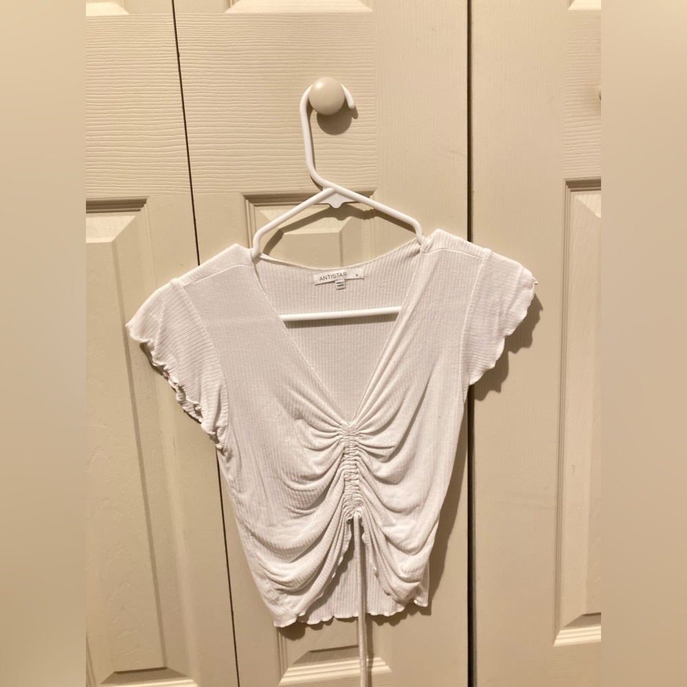 This shirt is loose and perfect for a night out! The middle is also adjustable.